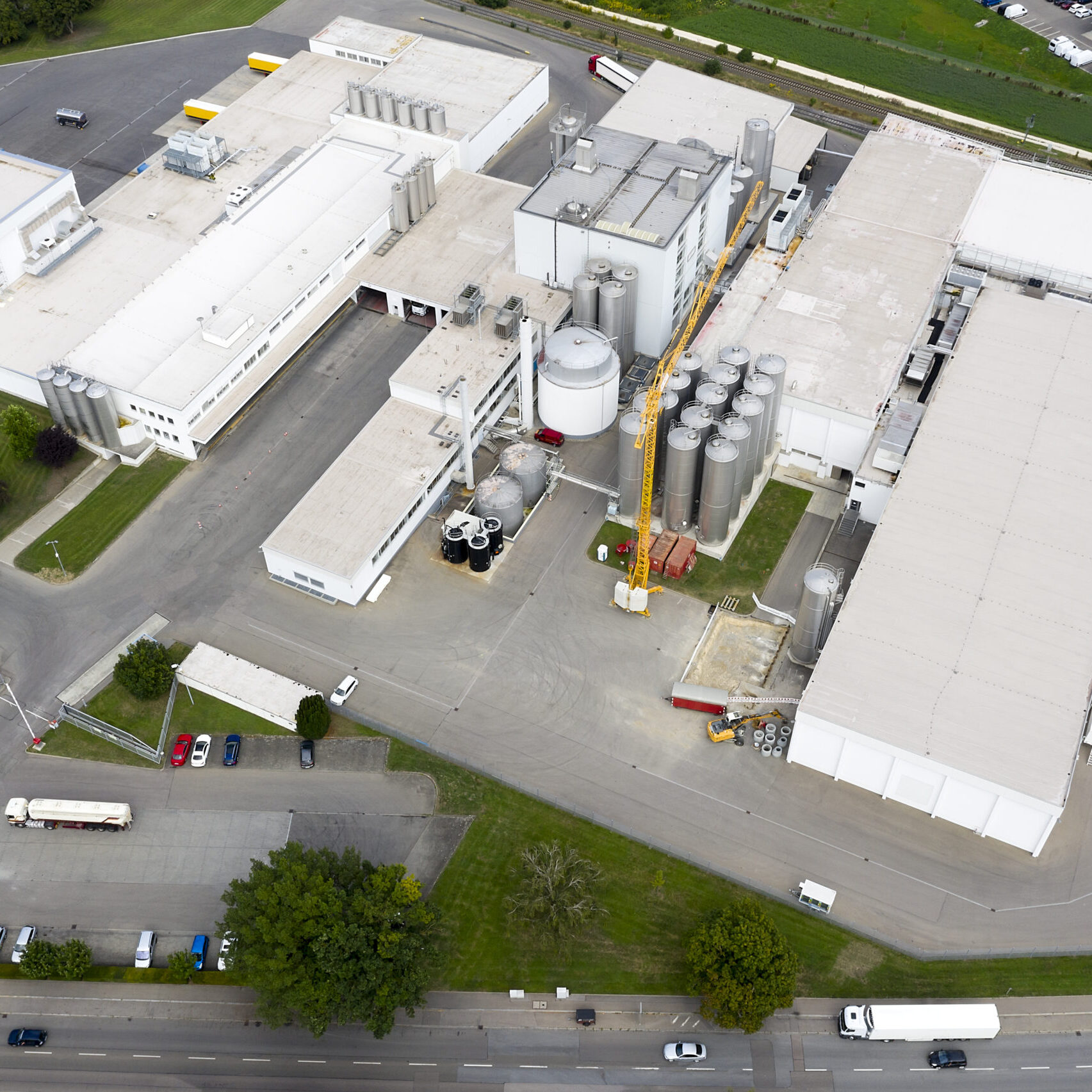 Aerial view of a stainless steel silos at dairy factory.